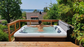 Ferienhaus Wellnesshütte mit Außenwhirlpool und herrlichem See-und Alpenblick